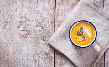 Pumpkin cream soup with rosemary and cream.